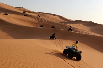 Dubai Morning Quad Bike with Sandboarding and Camel Ride