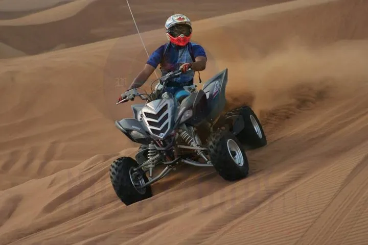 Dune Bashing with Quad Bike and Sand Boarding from Dubai