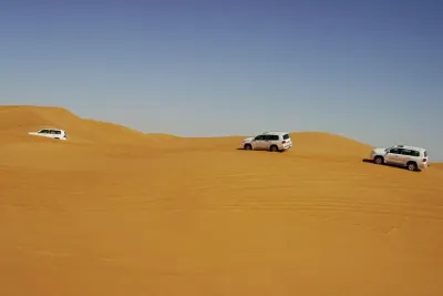 Morning Dubai Red Dunes Safari With Camel Ride & Sand boarding