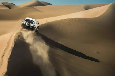 Morning Dubai Desert Safari with Dune Bashing & Sandboarding & Camel Riding
