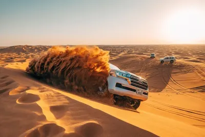 Morning Red Dune Desert Safari in Dubai with Camel Ride and Sand Boarding