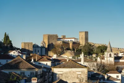 Transfer Lisbon to Porto with a visit to Óbidos and Nazaré - Private