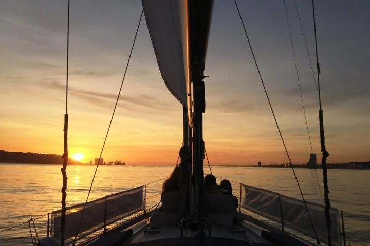 Lisbon Sunset Cruise on Traditional Boats with White Wine + Ebook