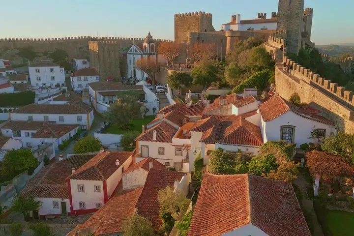 Private Lisbon to Porto Tour | Óbidos, Nazaré, Batalha & Coimbra